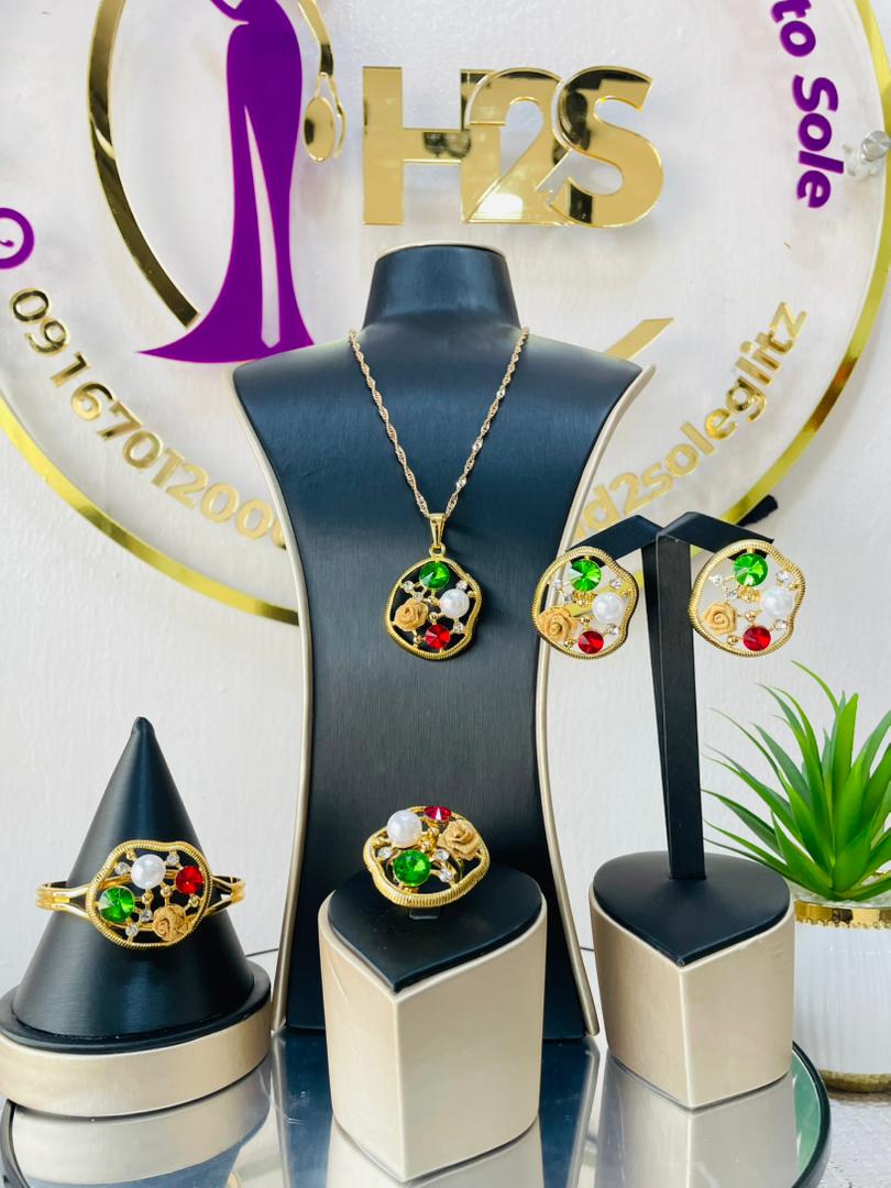 4 piece gold tone jewelry set (Pendant, Bracelet, Earrings and Ring)