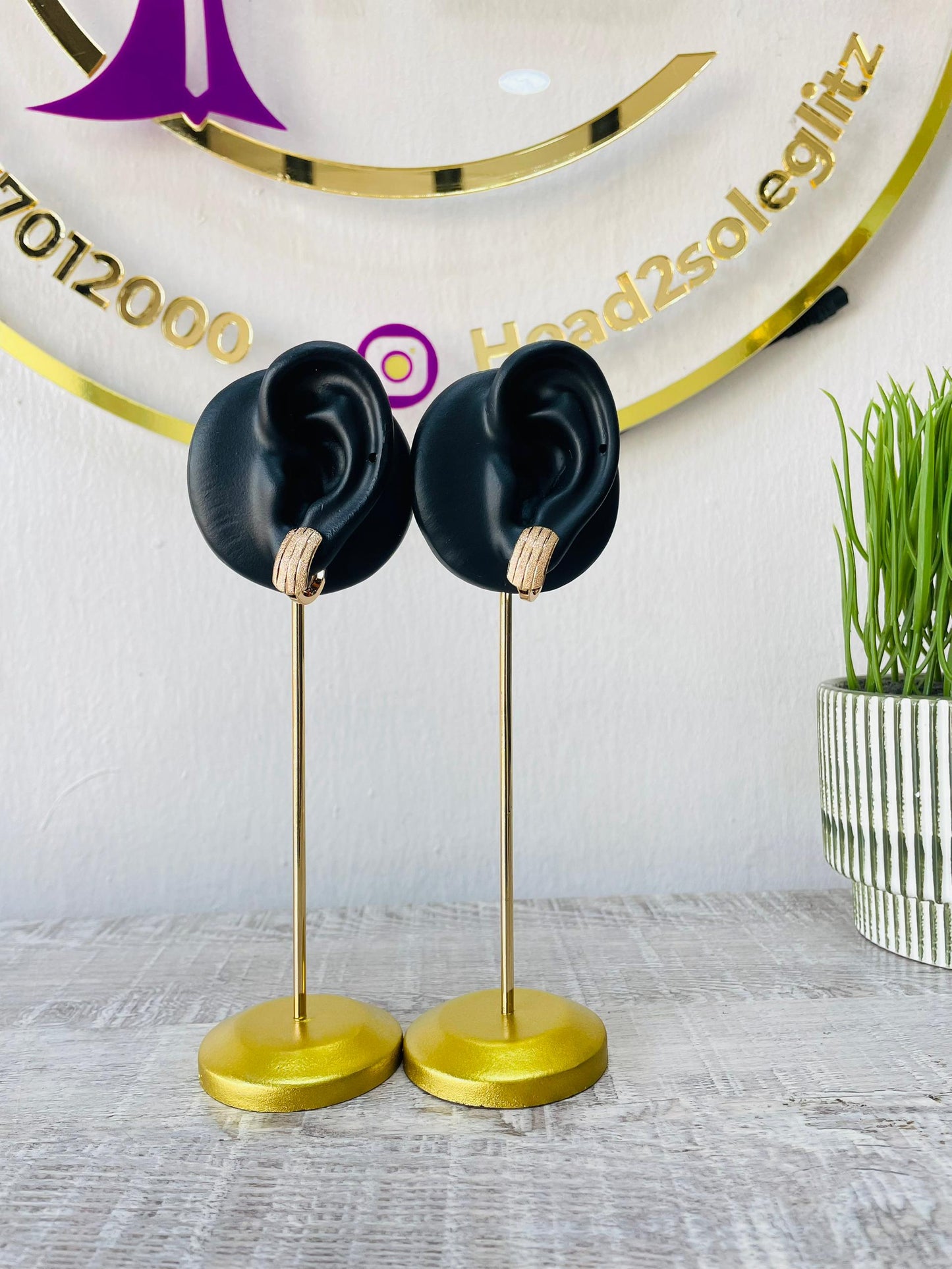 Shield textured gold tone stud earrings