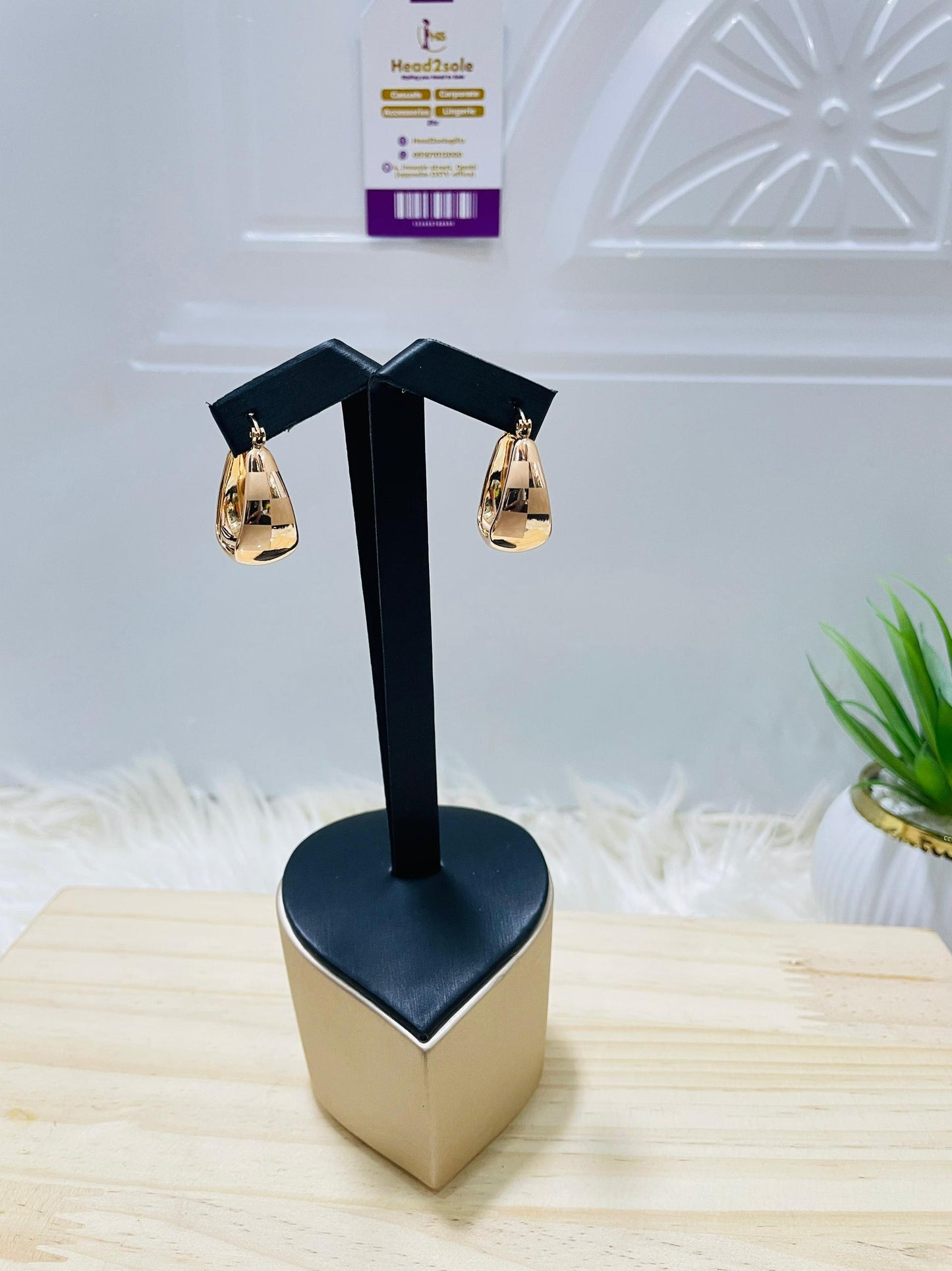 Large teardrop gold tone earrings