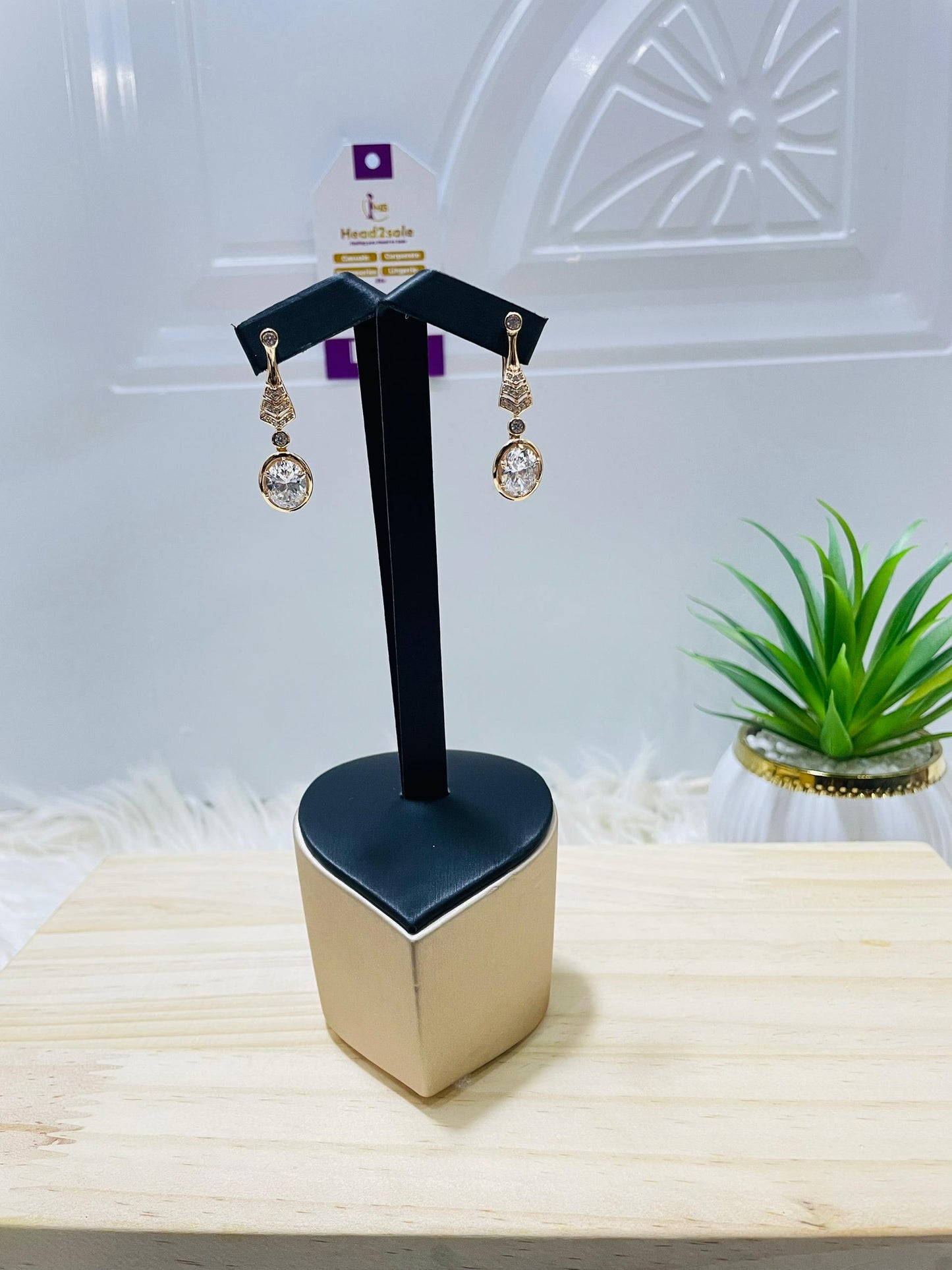 Crystal accent petal chain gold tone earrings
