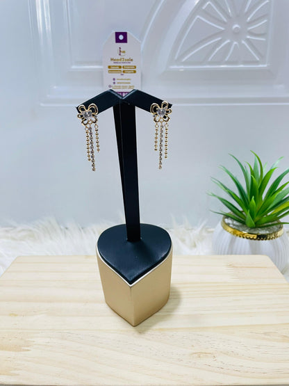 Crystal accent petal chain gold tone earrings
